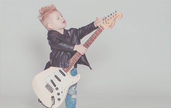Child with electric guitar